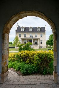 View of New Amherst Home through clock tower arch