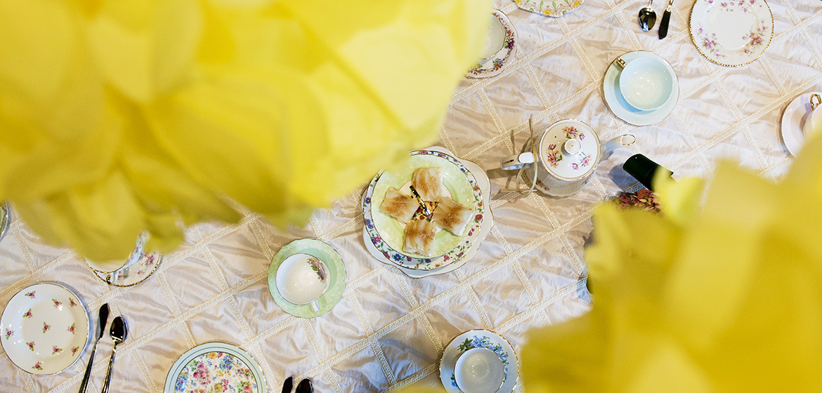Yellow Flowers above Tea Cups