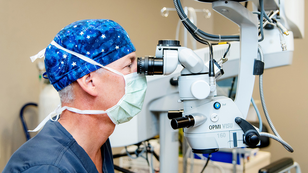 Ophthalmologists Dr. Rabinovitch looks through a phoropter