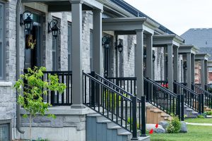 Row of New Amherst Homes in grey brick exterior