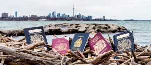 Multiple Passports with the Cn Tower in the background