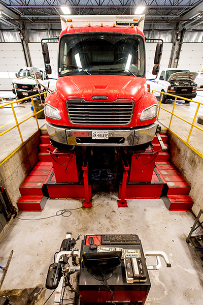 Red Truck in Auto Repair Pit