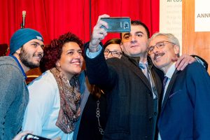 Attendees take a selfie with Mario Calla of Costi