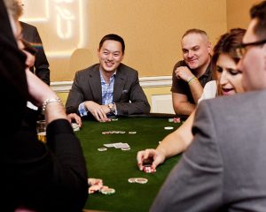 Guests enjoy a game of poker