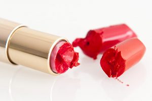 Yves Rocher beauty product photography, bright lipstick in gold case