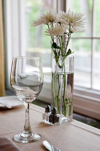 Dinning table flowers and glass