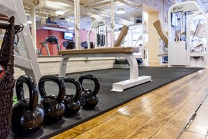 Workout bench and kettle bells inside the gym